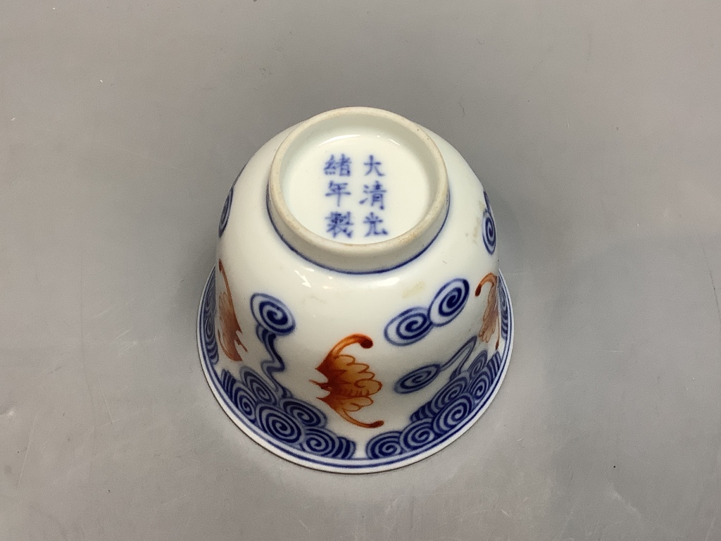 A Chinese underglaze blue and iron red 'bat' cup, height 6cm